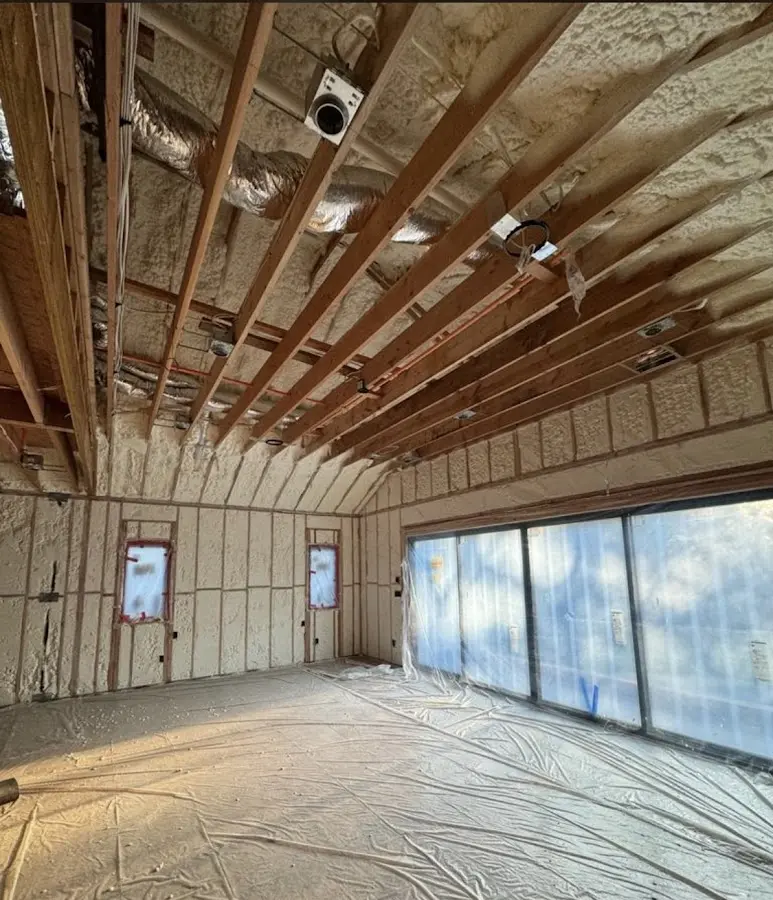 Interior walls and ceiling insulated with spray foam during new construction in Cottonwood Heights